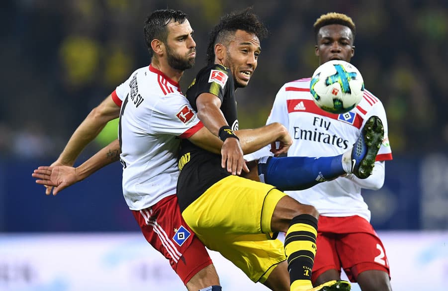 Mavraj and Jung face Dortmund super-star striker Aubameyang who made it 2-0 to Dortmund.