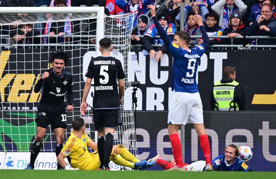 Gui Ramos celebrates having cleared Fiete Arp's effort off the line.