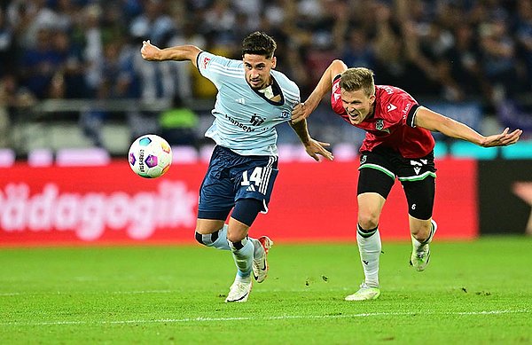 Giving nothing away: HSV captain Ludovit Reis and Germany international Marcel Halstenberg compete for the ball.