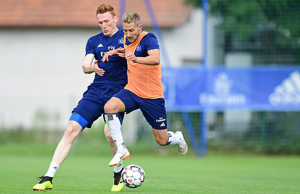 A challenge between the 21-year-old Scot and Lewis Holtby.
