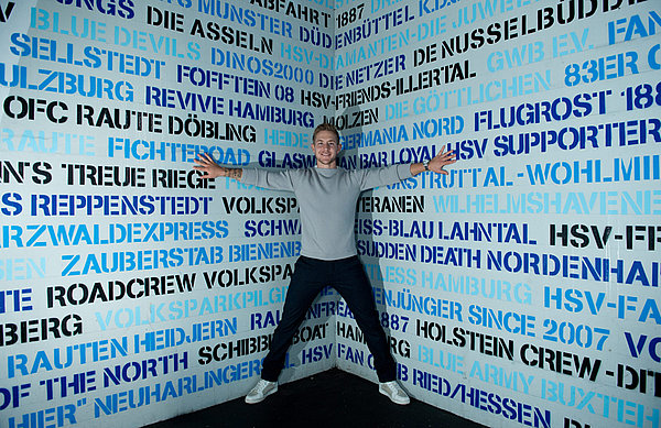 Fan favourite Lewis Holtby posing at the HSV staircase where several names of registered fan clubs have had there names etched in HSV history. 
