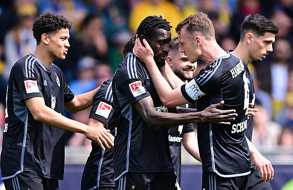 Captain Sebastian Schonlau celebrates with Bakery Jatta after the latter's goal made it 3-0 to the Rothosen.