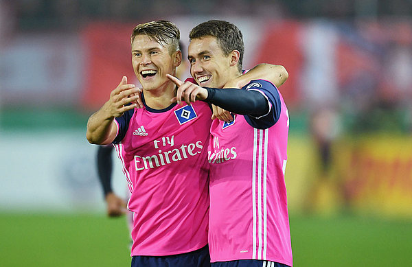 Matthias Ostrzolek and Luca Waldschmidt celebrating.