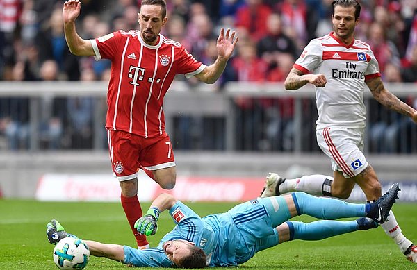 The start of the end: Ribéry rounds HSV keeper Mathenia and pokes the ball home to give Munich an early lead.