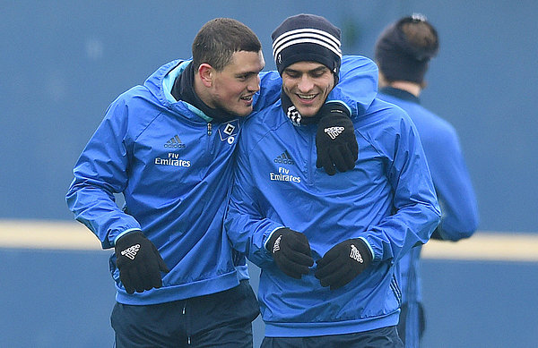 Papadopouolos hugs Filip Kostic during training.