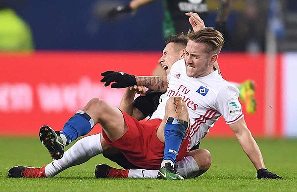 Red! Lewis Holtby was sent off for this incident. Later Augsburg’s Dominik Kohr who was involved was also sent off.